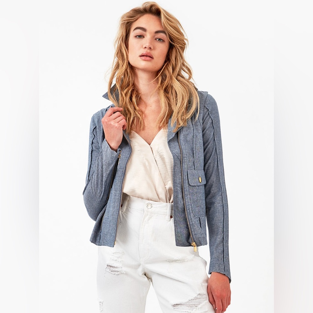 Cropped length blue fabric moto jacket with gold buckle details
